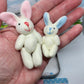 🔥 50% OFF! 🎁 Bunny Mummy & Baby Plush Pocket Tin – Handmade Easter Collectible with Cozy Blanket (Pink/Blue Ears) 🐇🎁